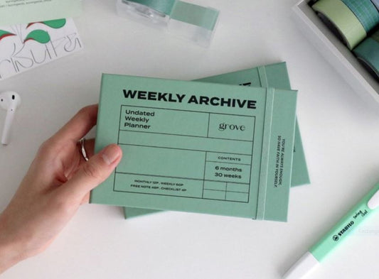 Minimalist weekly planner in mint green showcasing clean design principles for organized new year planning